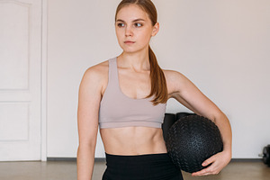 Athletic woman posing healthy lifestyle slam ball, a Person Photo by Photo Drive Studio