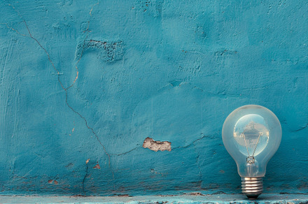 A transparent light bulb is position, a Photo by Tanuart