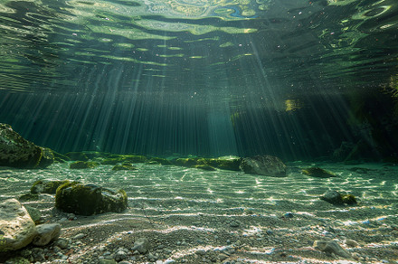 Sunlight shines through the clear wa, a Photo by Iftikhar Alam