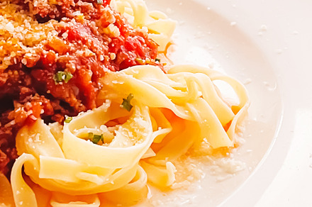 Pasta with bolognese sauce and parmesan cheese, homemade food an, a Food & Drink Photo by Anneleven