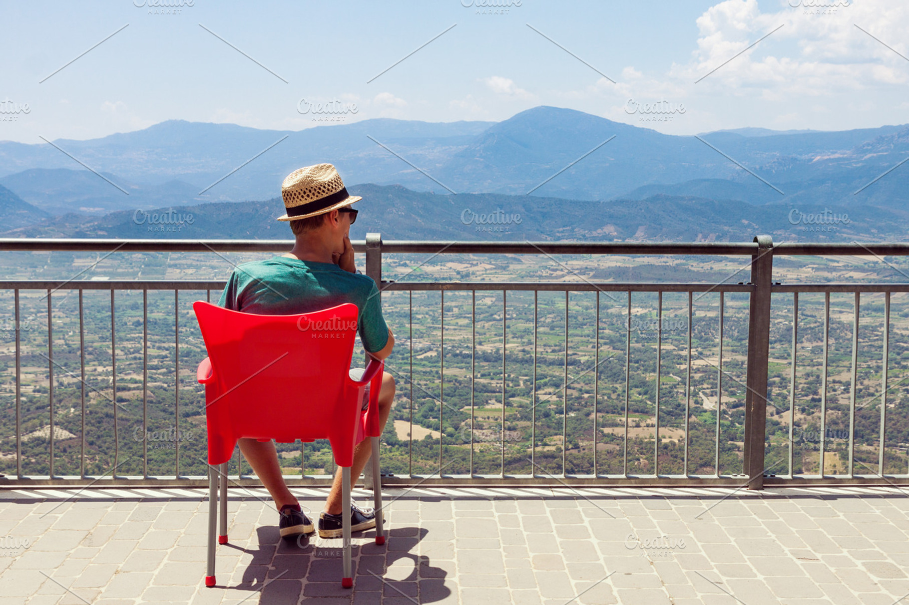 Teenager looking at mountain scenery, a Person Photo by BOOCYS