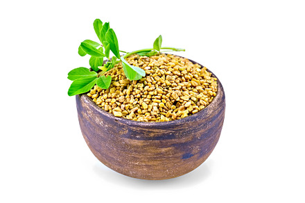 Fenugreek with leaf in clay bowl, a Food & Drink Photo by rezkrr