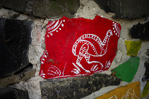 Colorful folk art on a stone wall featuring intricate animal design, a Photo by AS photostudio