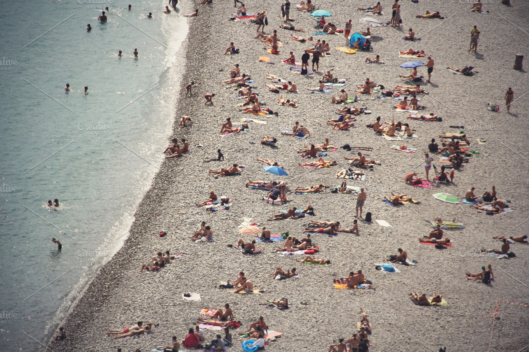 People on the beach containing people, beach, and travelling