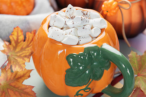 Hot cocoa in pumpkin mug on rustic table, a Food & Drink Photo by Olena Rudo