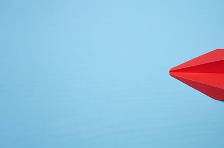 Red paper airplane on a blue background, travel concept, top vie, an Abstract Photo by ndanko