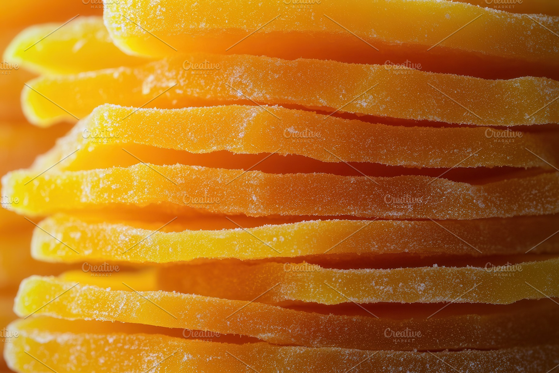 Vibrant orange dried mango slices, a Photo by Pavel_design