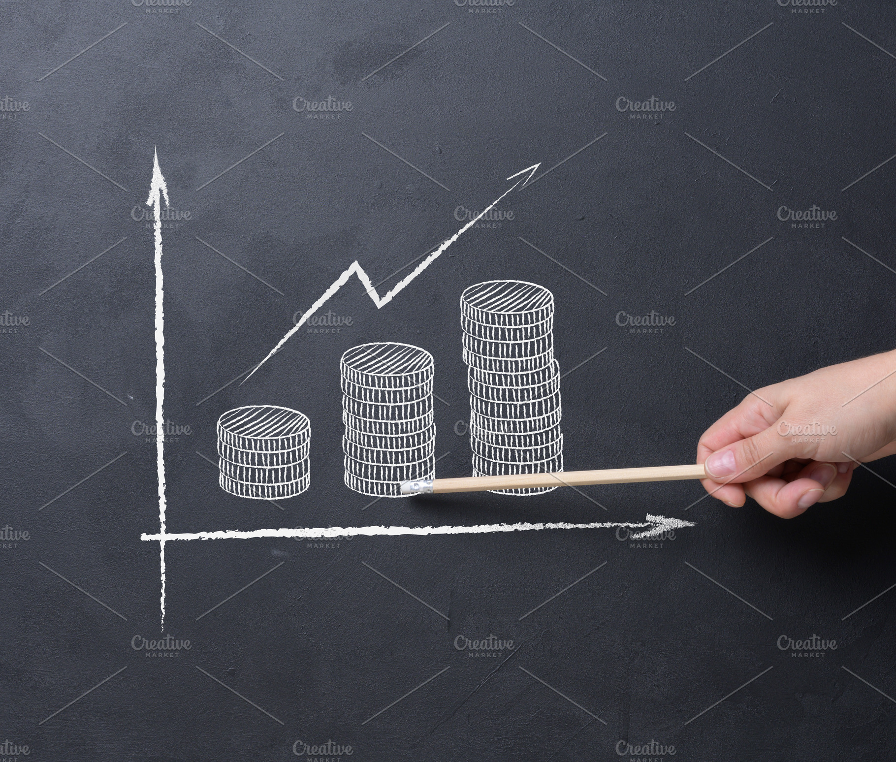 A person's hand with a pencil points to a chalked growth chart w, a Business Photo by ndanko