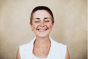 Woman with buzz cut finding joy and, a Person Photo by Anna Efetova