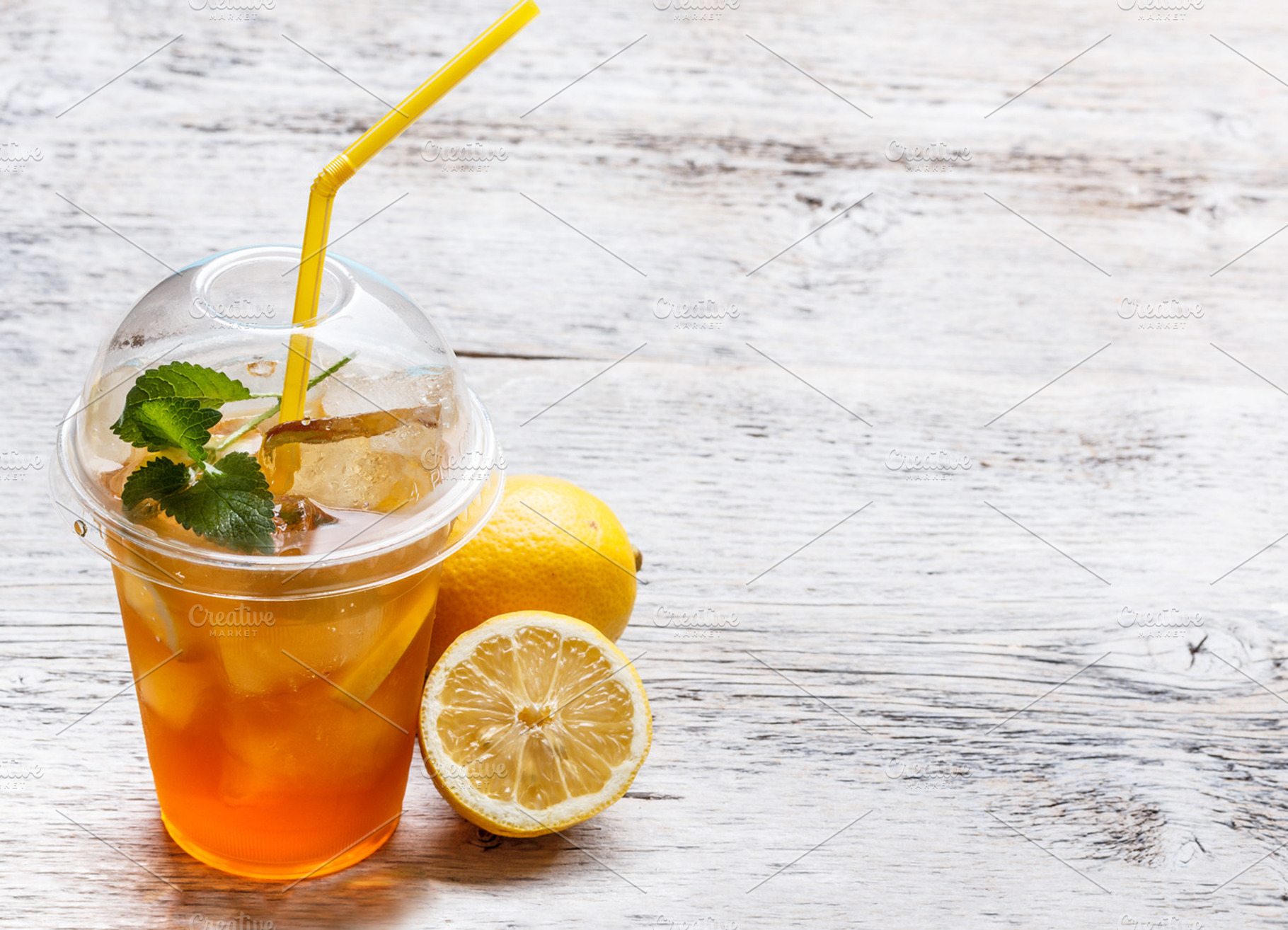 Fresh ice tea featuring cup, ice, and tea