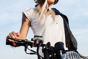 Fashion female biker girl with vintage custom motorcycle stock photo, a Person Photo by Aliaksei Kaponia