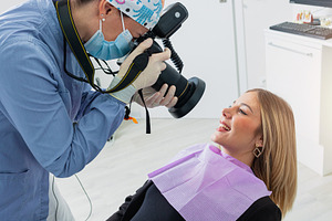 Dentist taking photos of patient's teeth in dental clinic, a Health & Medical Photo by Antonio Gravante Market