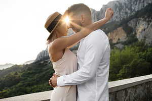 Young couple in love on the nature containing love, couple, and kiss
