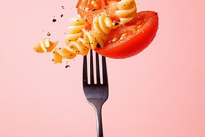 Sprightly pasta and tomato on fork, a Photo by Beautiful things