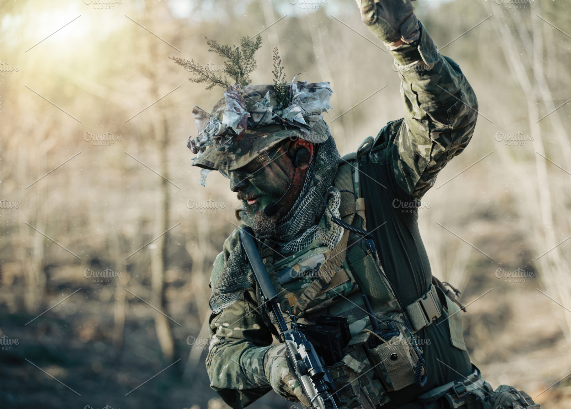 Soldier wearing camouflage giving orders during combat training in the forest, a Sports & Recreation Photo by Antonio Gravante Market