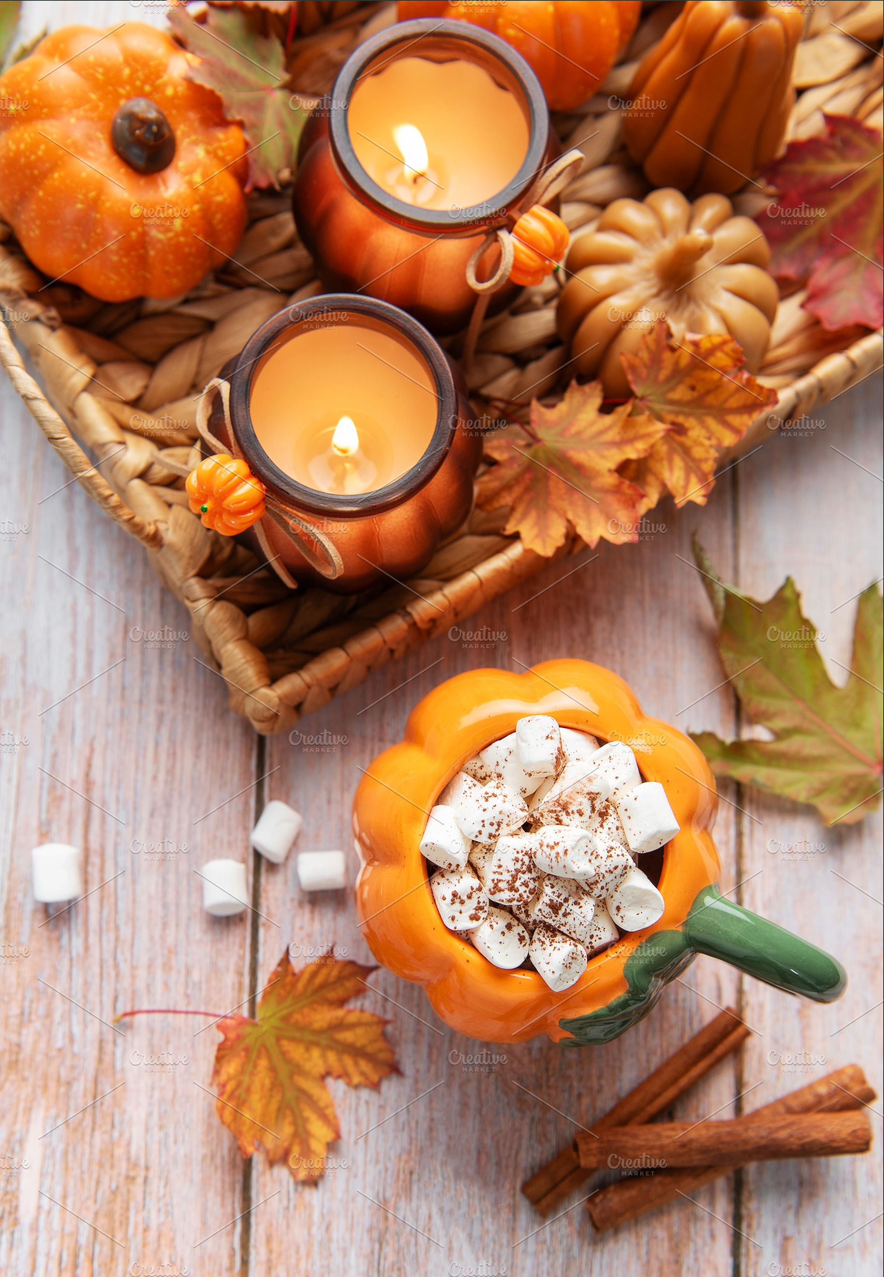 Cozy autumn arrangement with hot chocolate and candles, a Food & Drink Photo by Olena Rudo
