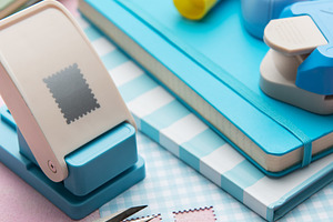 Crafting materials with paper punches and colorful notebooks, an Arts & Entertainment Photo by Olena Rudo