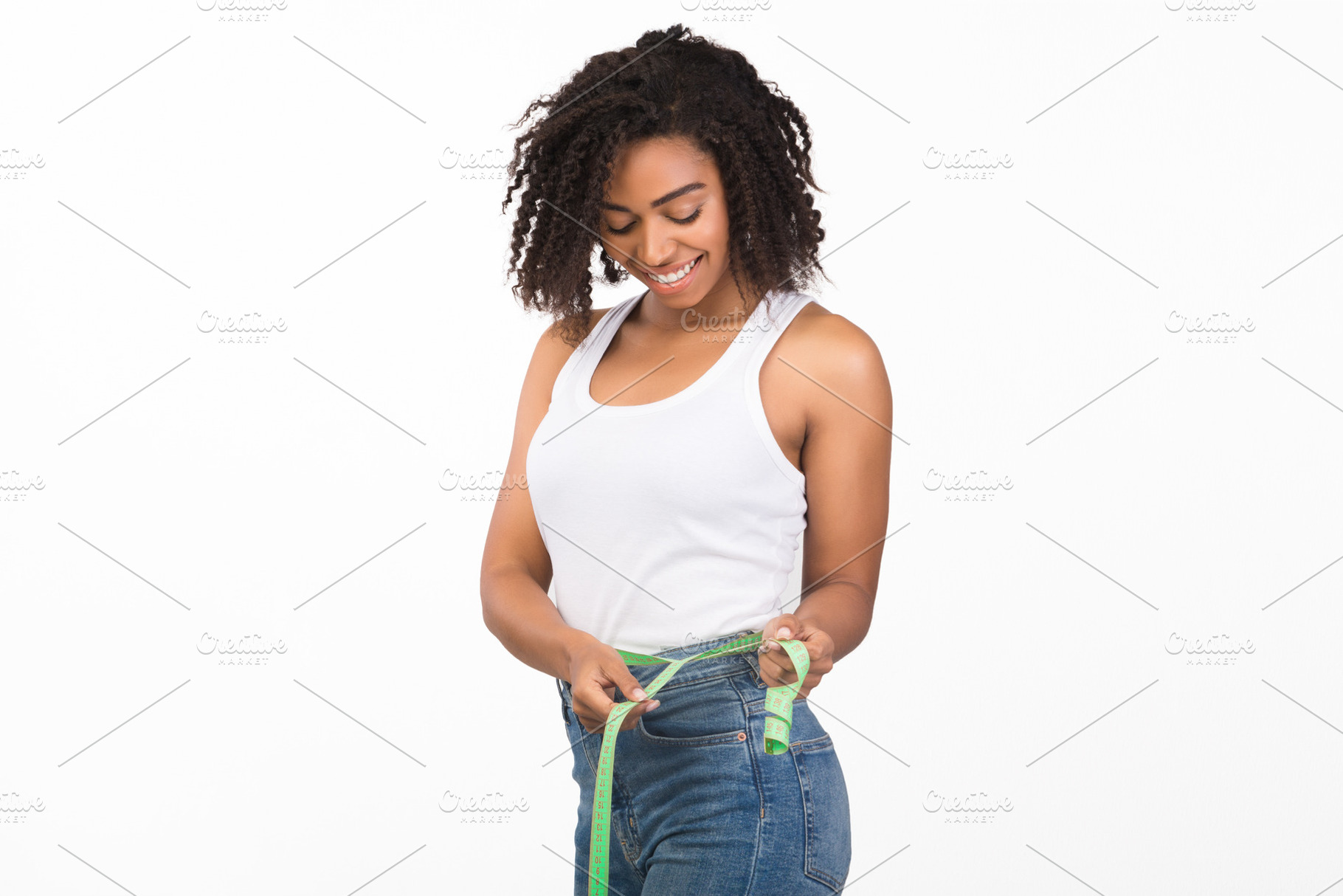 Portrait of happy young black woman with measuring tape, a Person Photo by Prostock-Studio