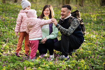 Family with two daughters on sunny forest. Outdoor spring leisur, a Person Photo by AS photostudio