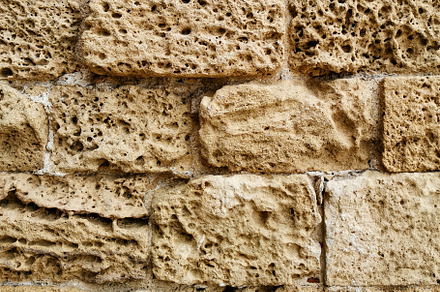 Old natural limestone wall, a Background Photo by Elena Vagengeim