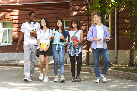 Group of students walking outdoors i, a Photo by Prostock-Studio