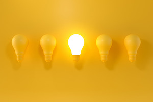 Glowing Light Bulb between the other
