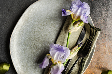 Table setting with pale blue iris flowers