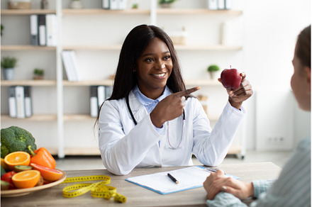 Female african american nutritionist, a Health & Medical Photo by Prostock-Studio
