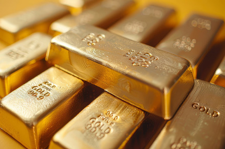 Stack Of Shiny Gold Bars On Yellow Background Highlighting Wealth And Investmen