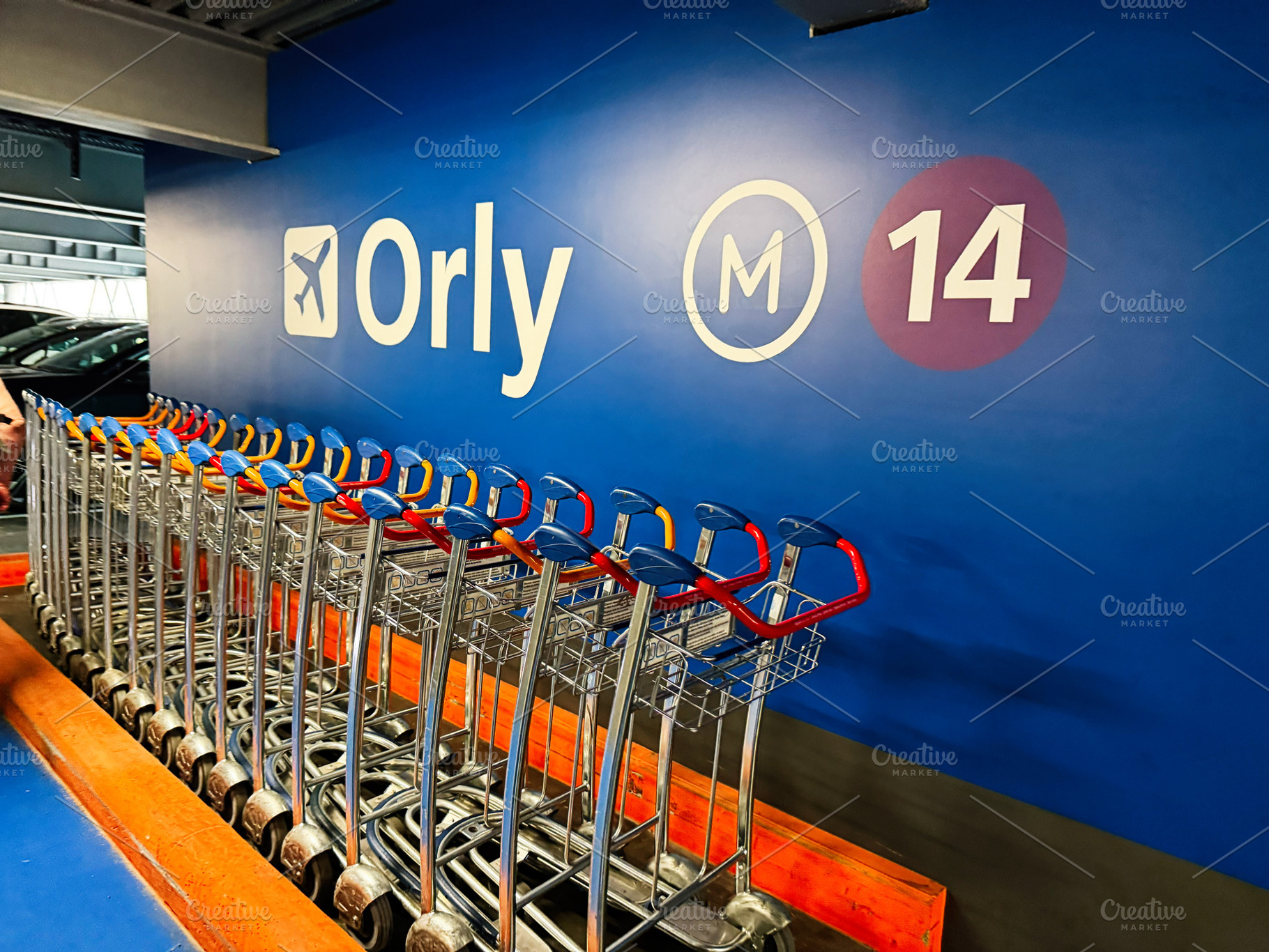 Row of airport luggage trolleys at Orly parking terminal M14 in Paris, France,, a Photo by AS photostudio