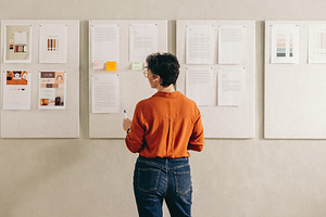 Rearview of a businesswoman giving a presentation during a confe, a Person Photo by Jacob Lund