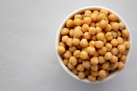 Homemade Preserved Chickpeas in a Bowl, top view. Copy space., a Food & Drink Photo by LiudmylaChuhunova