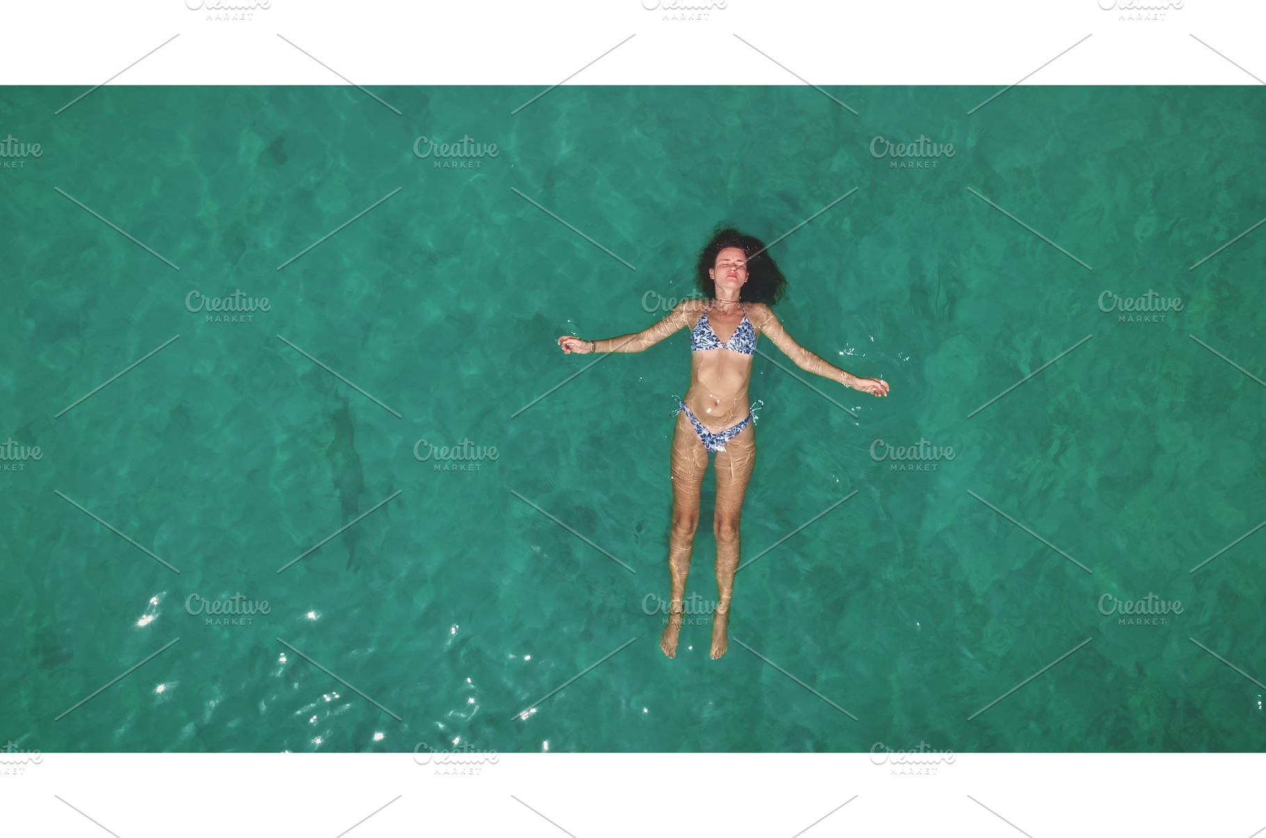 Woman relaxing floating on clear, a Person Photo by Goinyk