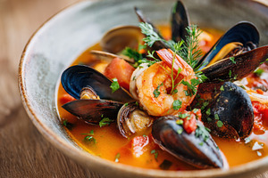 Delicious cooked mussels with lemon and bread, a Food & Drink Photo by AlyaAnd