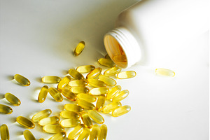 Gel capsules omega-3 laying near a, a Health & Medical Photo by volodymyrshtun13795