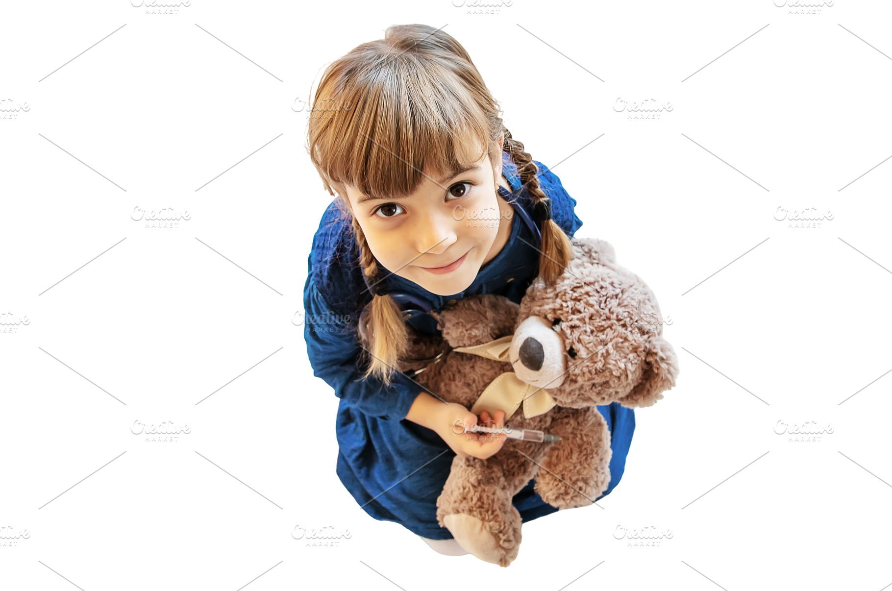child treats a bear. The game of the, a Health & Medical Photo by yanadjana