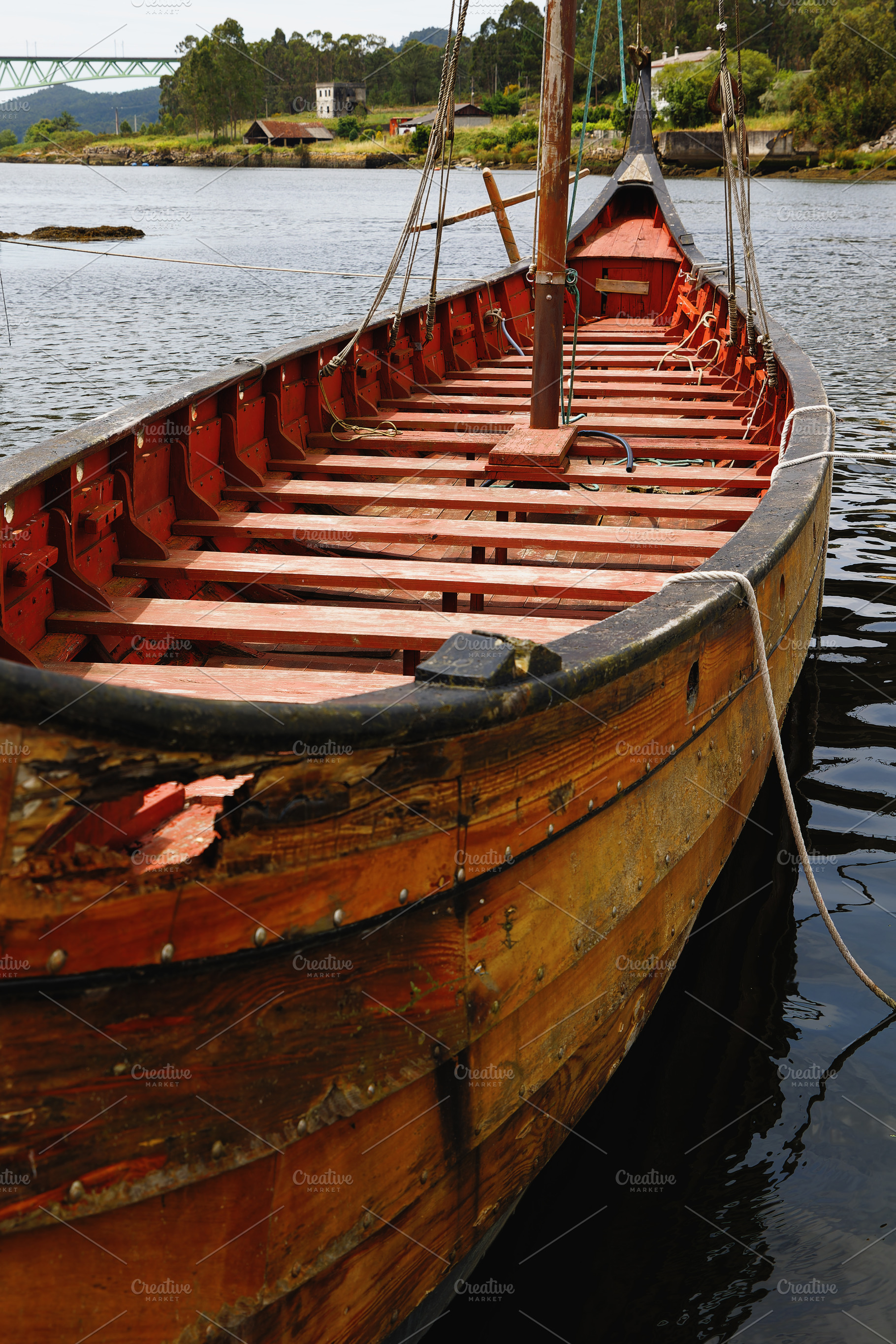 Wooden Viking Ship Anchored in a Cal, a Transportation Photo by Perpis