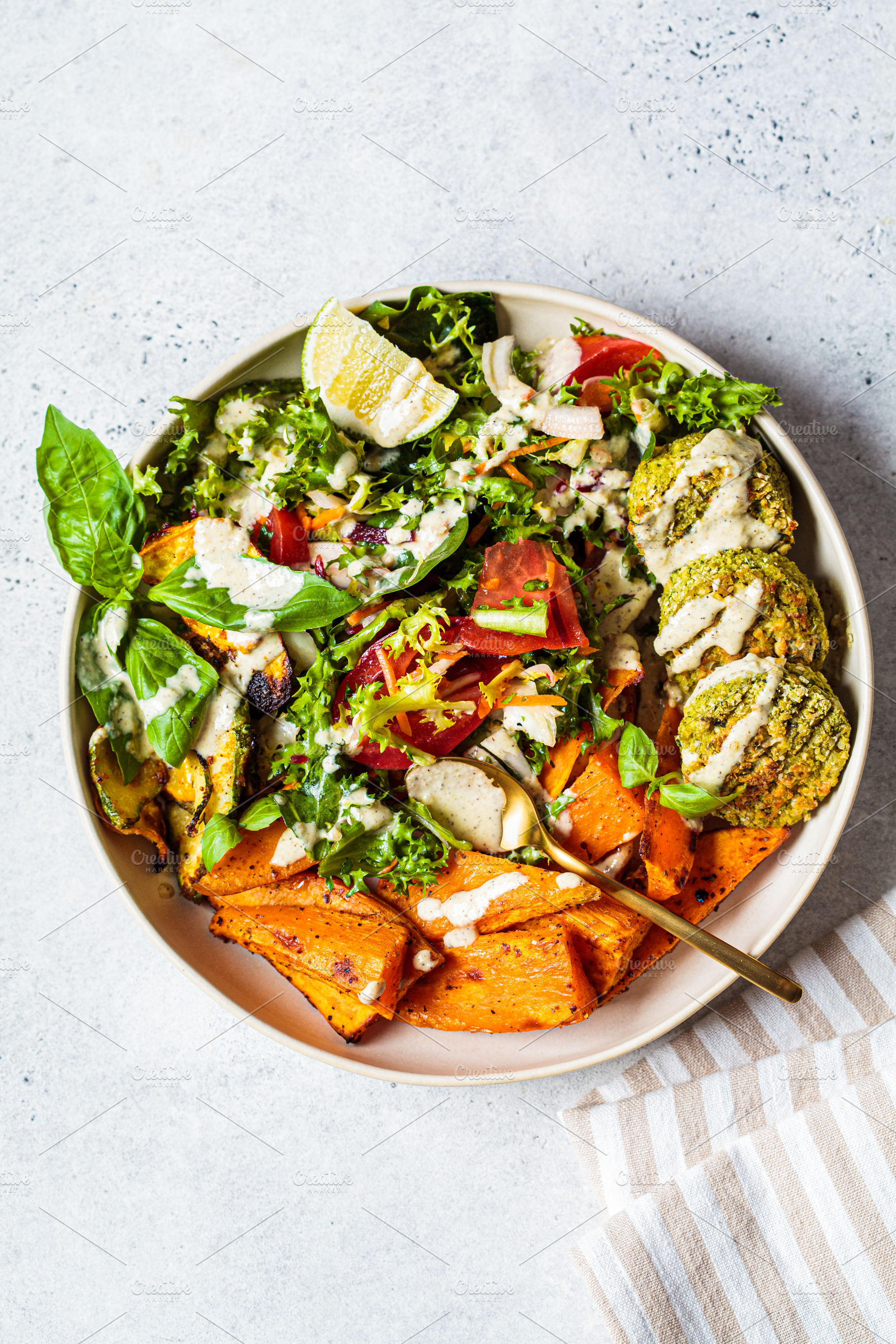 Falafel salad bowl featuring arabian, arabic, and background, a Food & Drink Photo by vaaseenaa