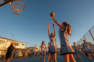 Girls Netball Game Sunset Goal, a Photo by Pixeness Studio