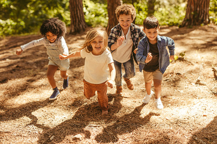 Kids running up in the forest, a Person Photo by Jacob Lund