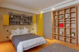 Bedroom featuring artwork, basket, and bed