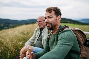 Mature son and his dad resting, a Person Photo by HalfPoint
