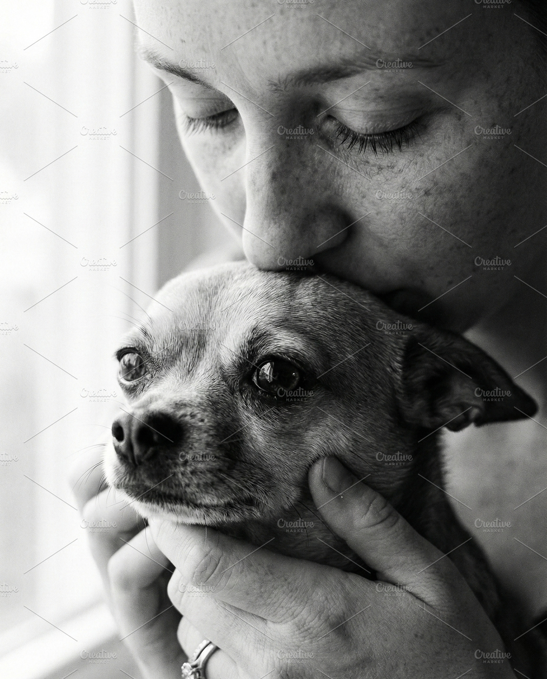 Woman Kissing Small Dog, an Animal Photo by Virgo Studio