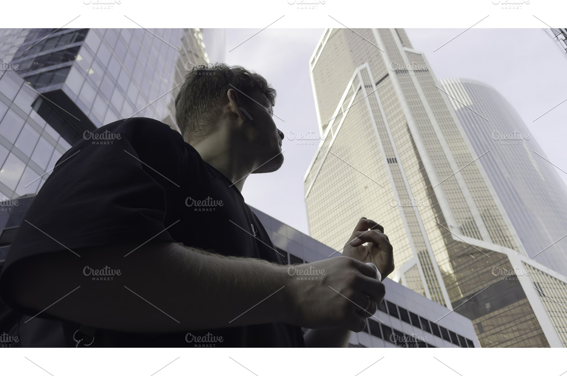 Young manager walking and talking on, an Architecture Photo by Media Whale Stock