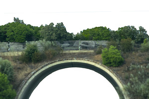 Arched roadway crossing rural, a Background Photo by DanFLCreativo