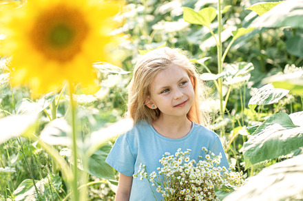 Beautiful little girl in sunflowers, a Person Photo by Olena Rudo