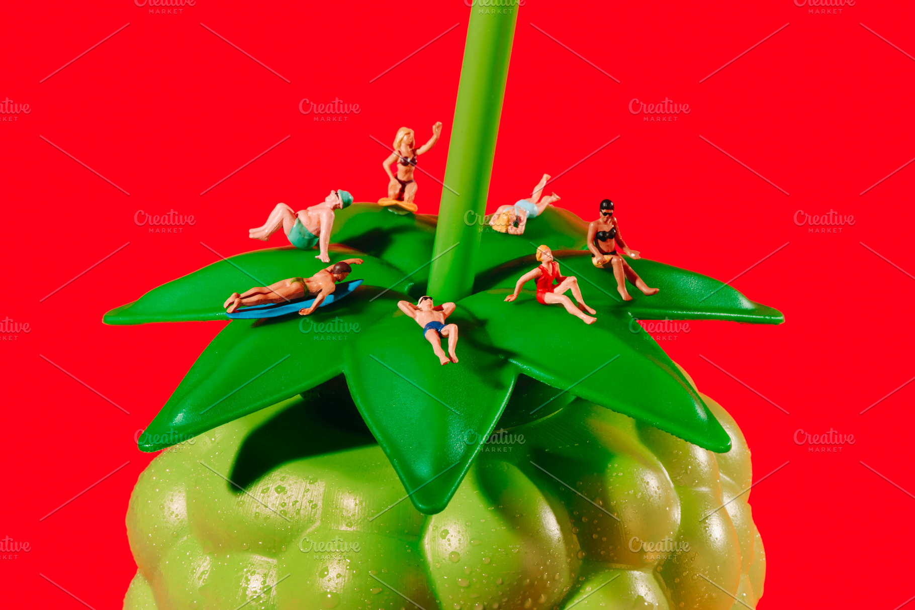 miniature holidaymakers on a fruit bottle, a Photo by Nito
