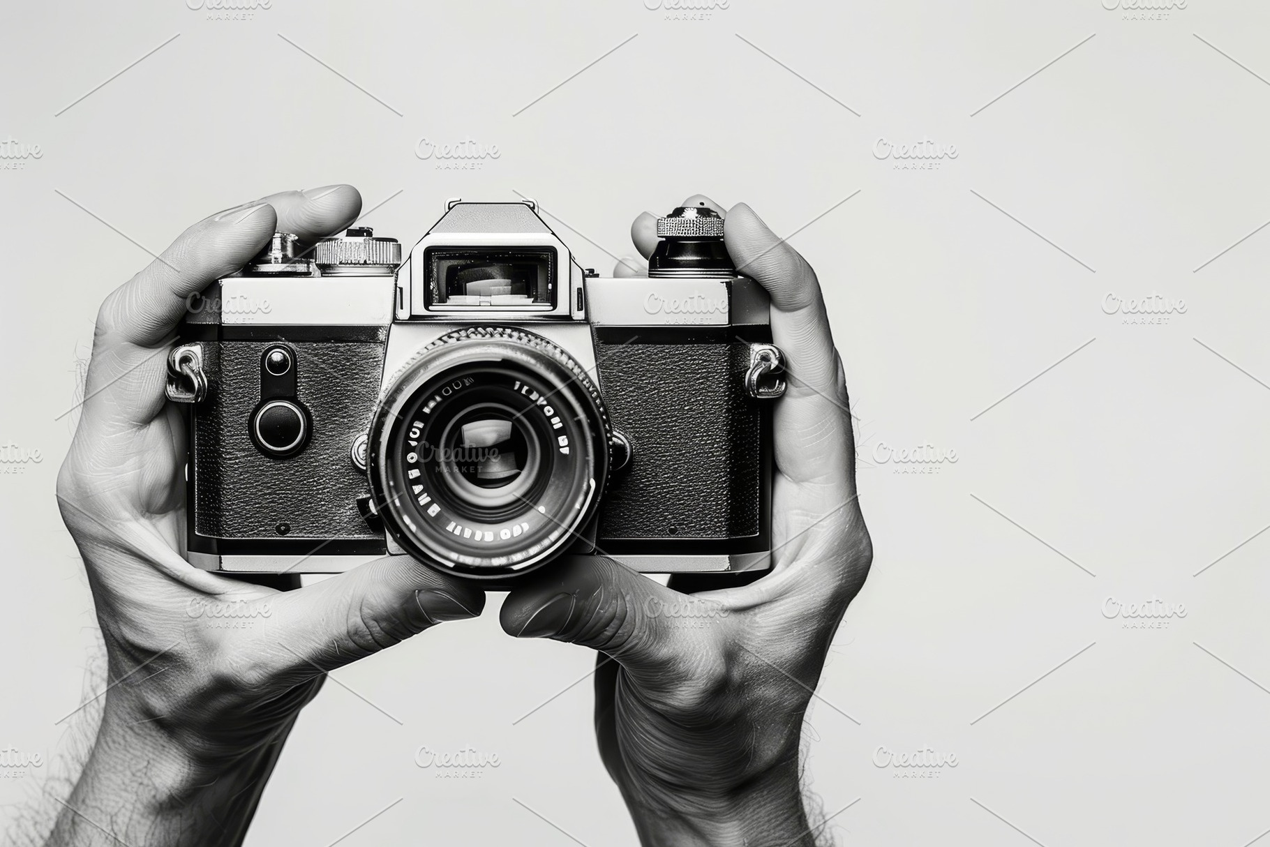Hands grasp a vintage camera, ready, a Photo by Tanuart