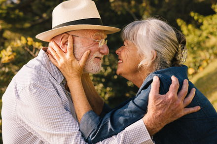 Happy senior couple smiling at each other affectionately, a Photo by Jacob Lund