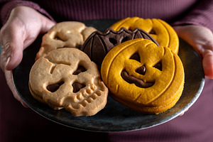Halloween cookies on plate held by woman, a Food & Drink Photo by etorres69